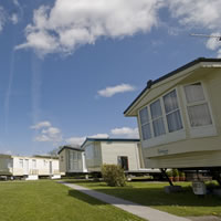 View of caravans positioned in the top of the main field at Morgan's Lodge